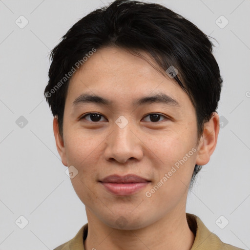 Joyful asian young-adult male with short  black hair and brown eyes