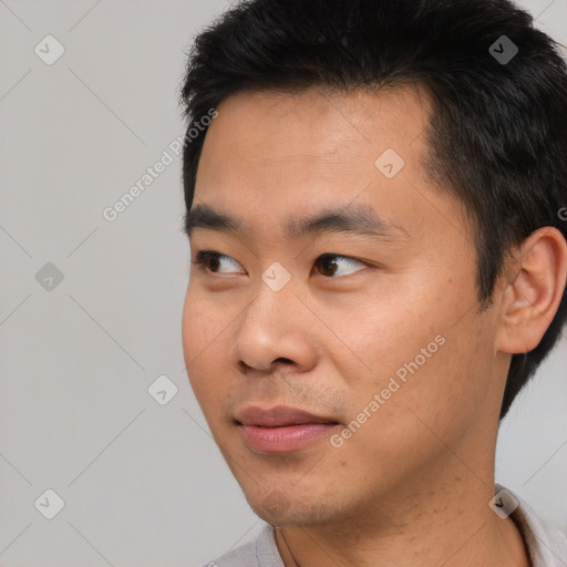 Neutral asian young-adult male with short  black hair and brown eyes