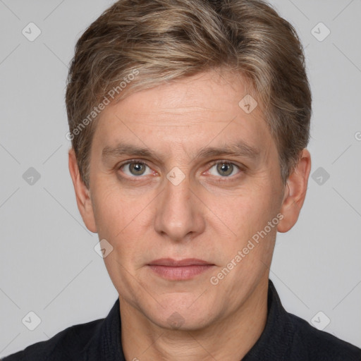 Joyful white adult male with short  brown hair and grey eyes