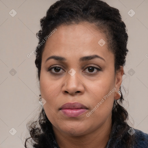 Joyful black adult female with short  brown hair and brown eyes