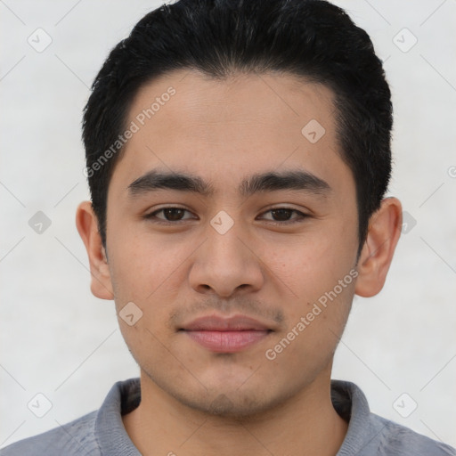 Joyful asian young-adult male with short  black hair and brown eyes