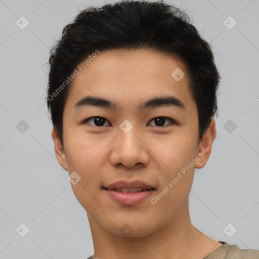 Joyful asian young-adult male with short  black hair and brown eyes