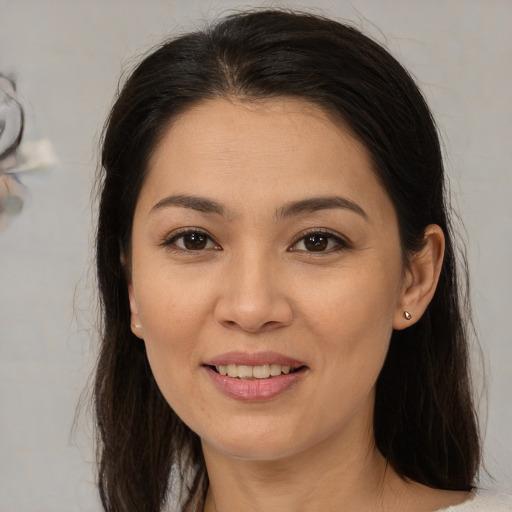 Joyful white young-adult female with medium  brown hair and brown eyes