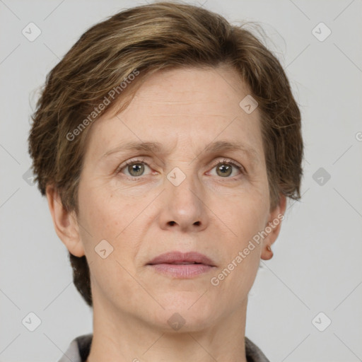 Joyful white adult female with short  brown hair and grey eyes