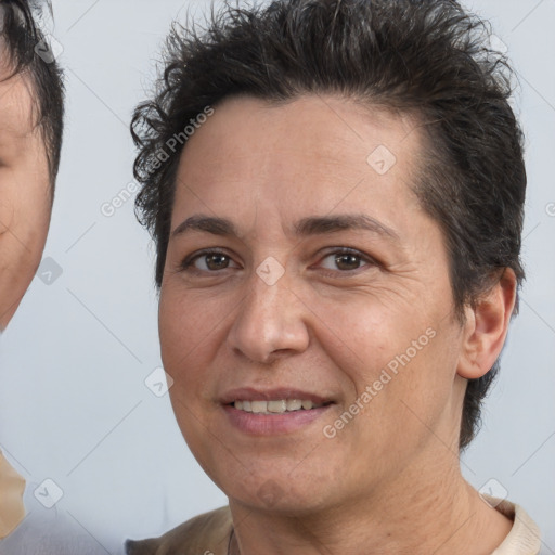 Joyful white adult female with short  brown hair and brown eyes