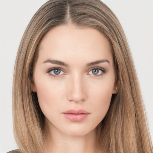 Neutral white young-adult female with long  brown hair and brown eyes