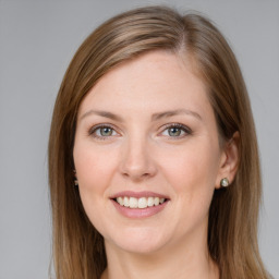 Joyful white young-adult female with long  brown hair and grey eyes