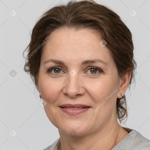 Joyful white adult female with medium  brown hair and grey eyes