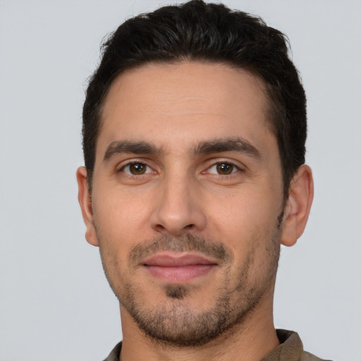 Joyful white young-adult male with short  brown hair and brown eyes