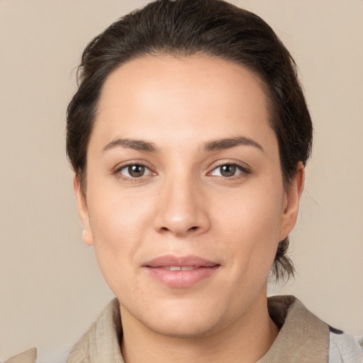 Joyful white young-adult female with medium  brown hair and brown eyes