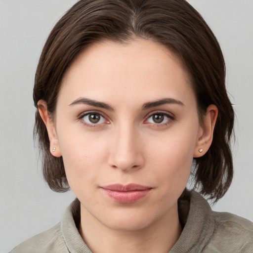 Neutral white young-adult female with medium  brown hair and brown eyes