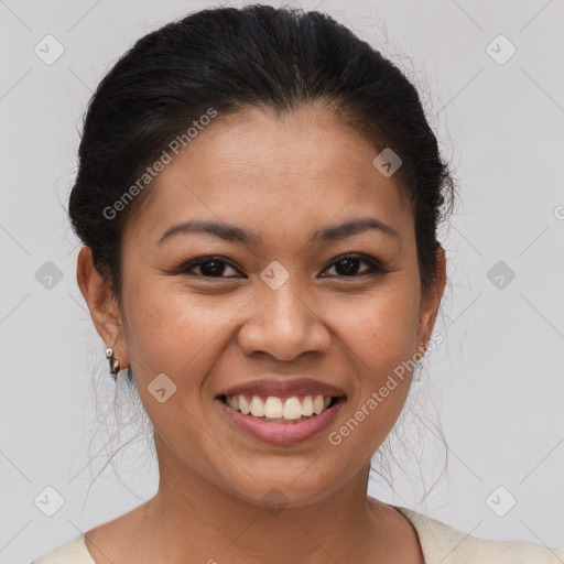 Joyful latino young-adult female with medium  brown hair and brown eyes