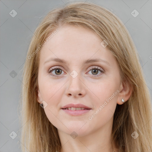 Joyful white young-adult female with long  brown hair and blue eyes