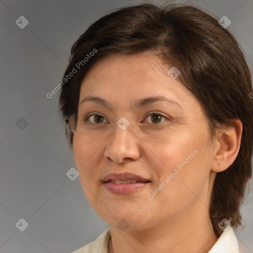 Joyful white adult female with medium  brown hair and brown eyes