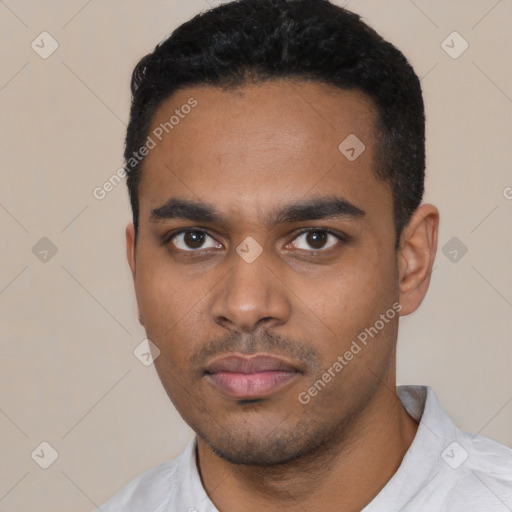 Neutral latino young-adult male with short  black hair and brown eyes