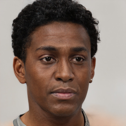 Neutral black young-adult male with short  brown hair and brown eyes