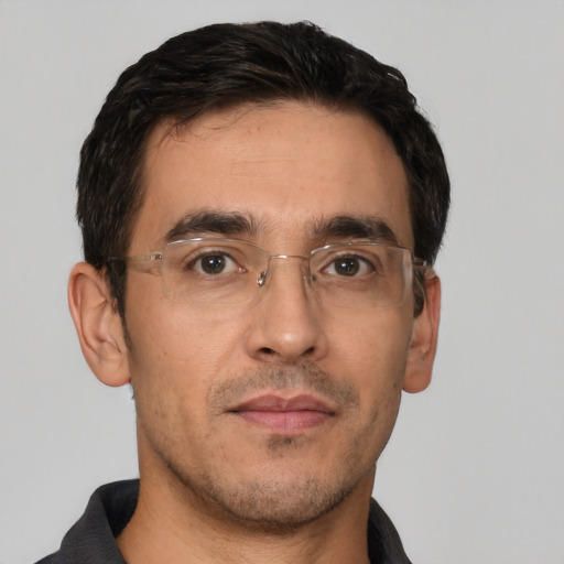 Neutral white young-adult male with short  black hair and brown eyes