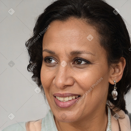 Joyful black adult female with medium  brown hair and brown eyes