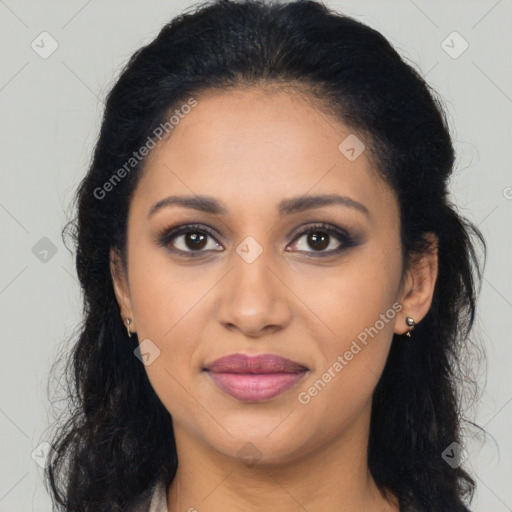 Joyful latino young-adult female with long  brown hair and brown eyes