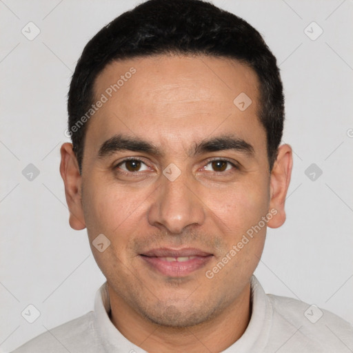 Joyful white young-adult male with short  black hair and brown eyes