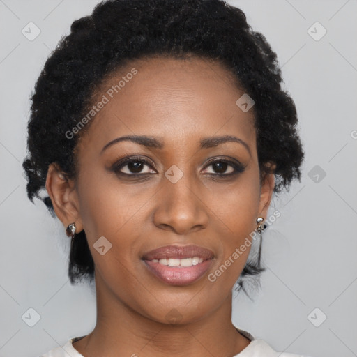 Joyful black young-adult female with short  brown hair and brown eyes