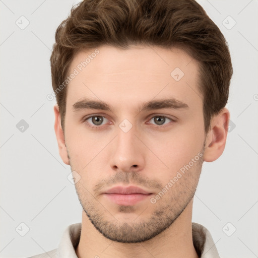 Neutral white young-adult male with short  brown hair and grey eyes