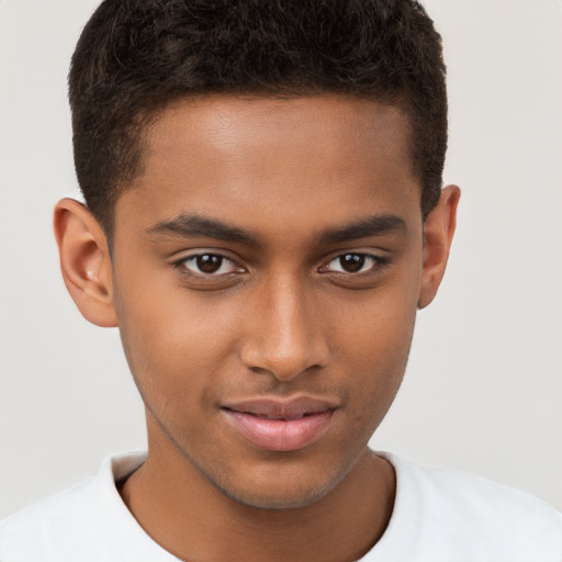 Joyful black young-adult male with short  brown hair and brown eyes