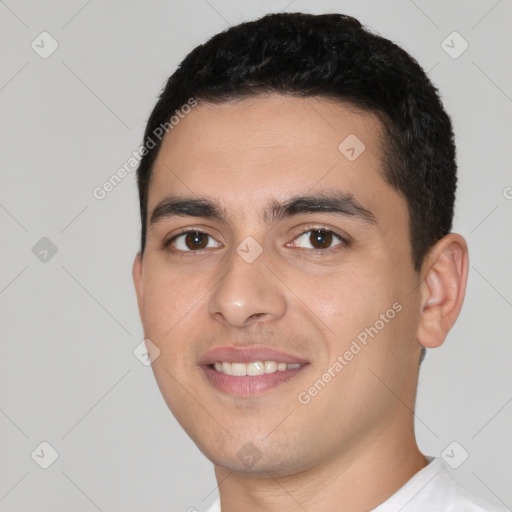 Joyful white young-adult male with short  black hair and brown eyes