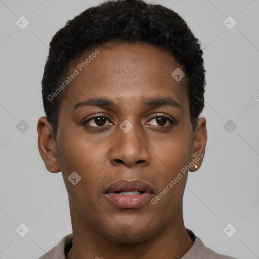 Joyful black young-adult male with short  black hair and brown eyes