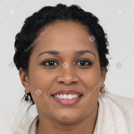 Joyful black young-adult female with long  brown hair and brown eyes