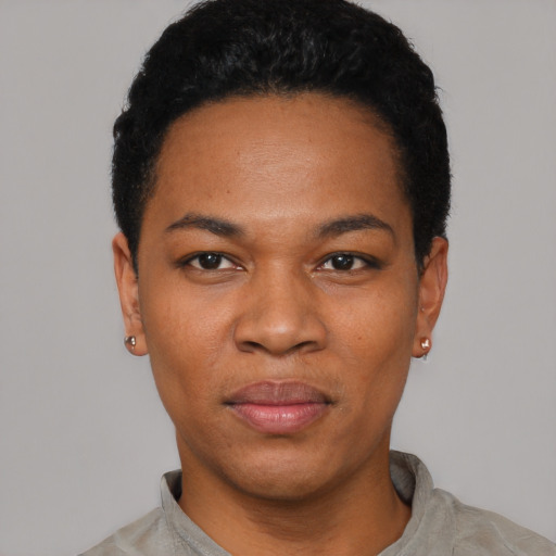 Joyful black young-adult female with short  black hair and brown eyes