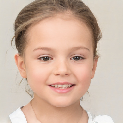 Joyful white child female with medium  brown hair and brown eyes