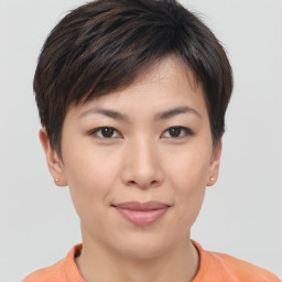 Joyful asian young-adult female with short  brown hair and brown eyes