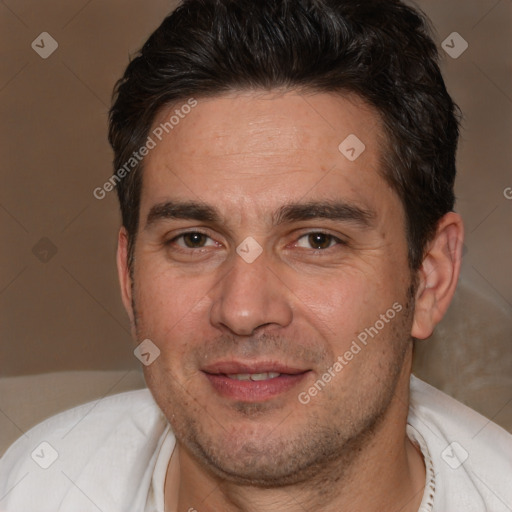 Joyful white adult male with short  brown hair and brown eyes