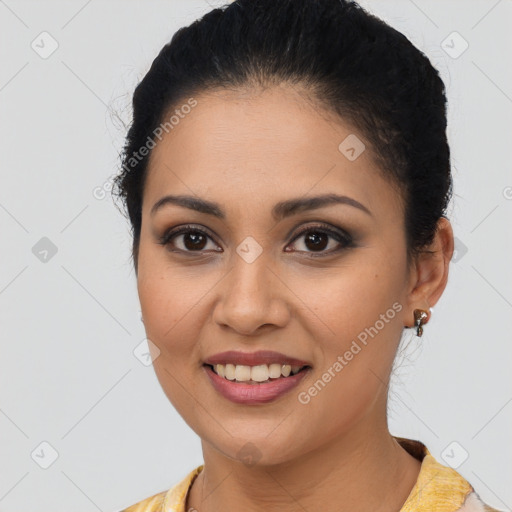 Joyful latino young-adult female with long  brown hair and brown eyes