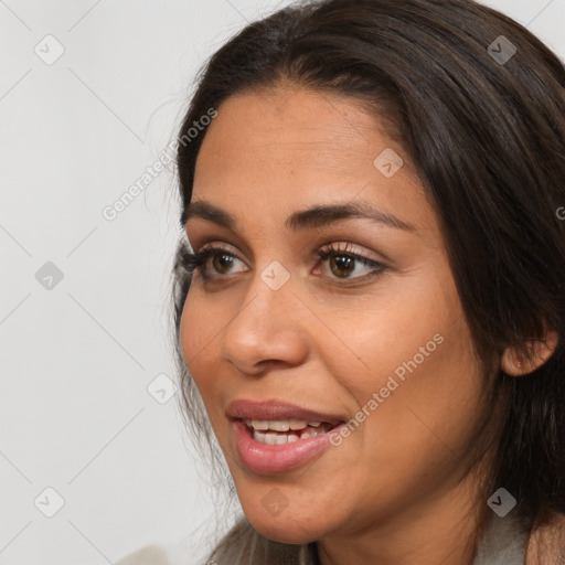 Joyful white adult female with long  brown hair and brown eyes