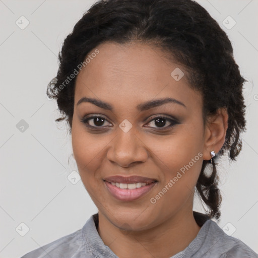 Joyful black young-adult female with medium  black hair and brown eyes