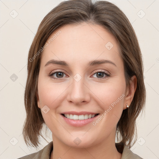 Joyful white young-adult female with medium  brown hair and grey eyes