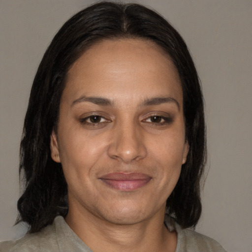 Joyful white adult female with medium  brown hair and brown eyes