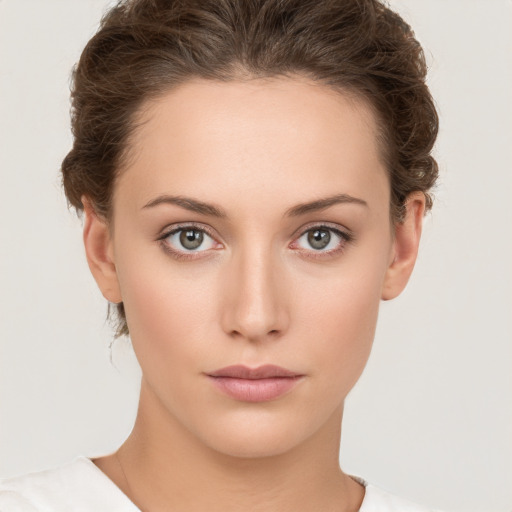 Neutral white young-adult female with short  brown hair and brown eyes