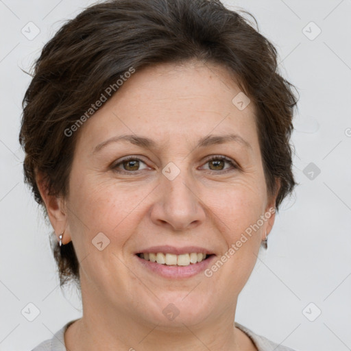 Joyful white adult female with short  brown hair and grey eyes