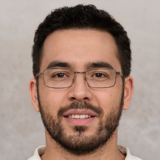 Joyful white young-adult male with short  brown hair and brown eyes