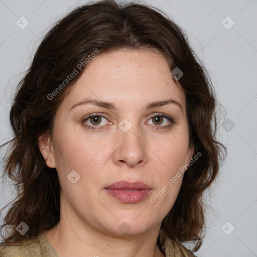 Joyful white adult female with medium  brown hair and green eyes