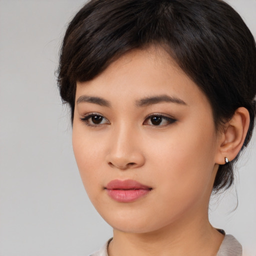 Neutral asian young-adult female with medium  black hair and brown eyes
