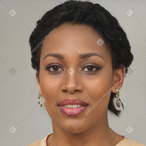 Joyful black young-adult female with short  black hair and brown eyes