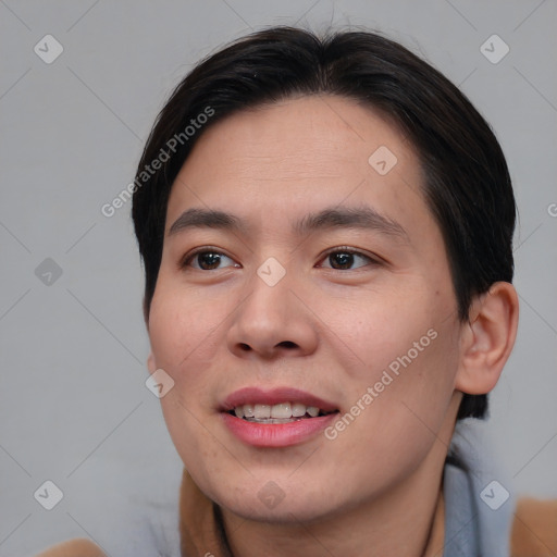 Joyful asian young-adult male with short  brown hair and brown eyes