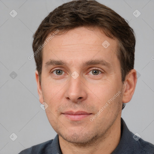 Joyful white adult male with short  brown hair and grey eyes