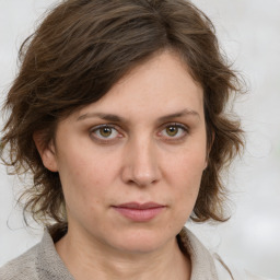 Neutral white young-adult female with medium  brown hair and green eyes