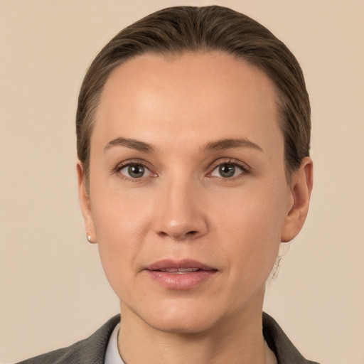 Joyful white adult female with short  brown hair and brown eyes