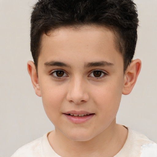 Joyful white child male with short  brown hair and brown eyes